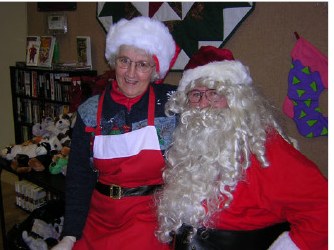 Mrs. Claus and Santa in the center's kitchen